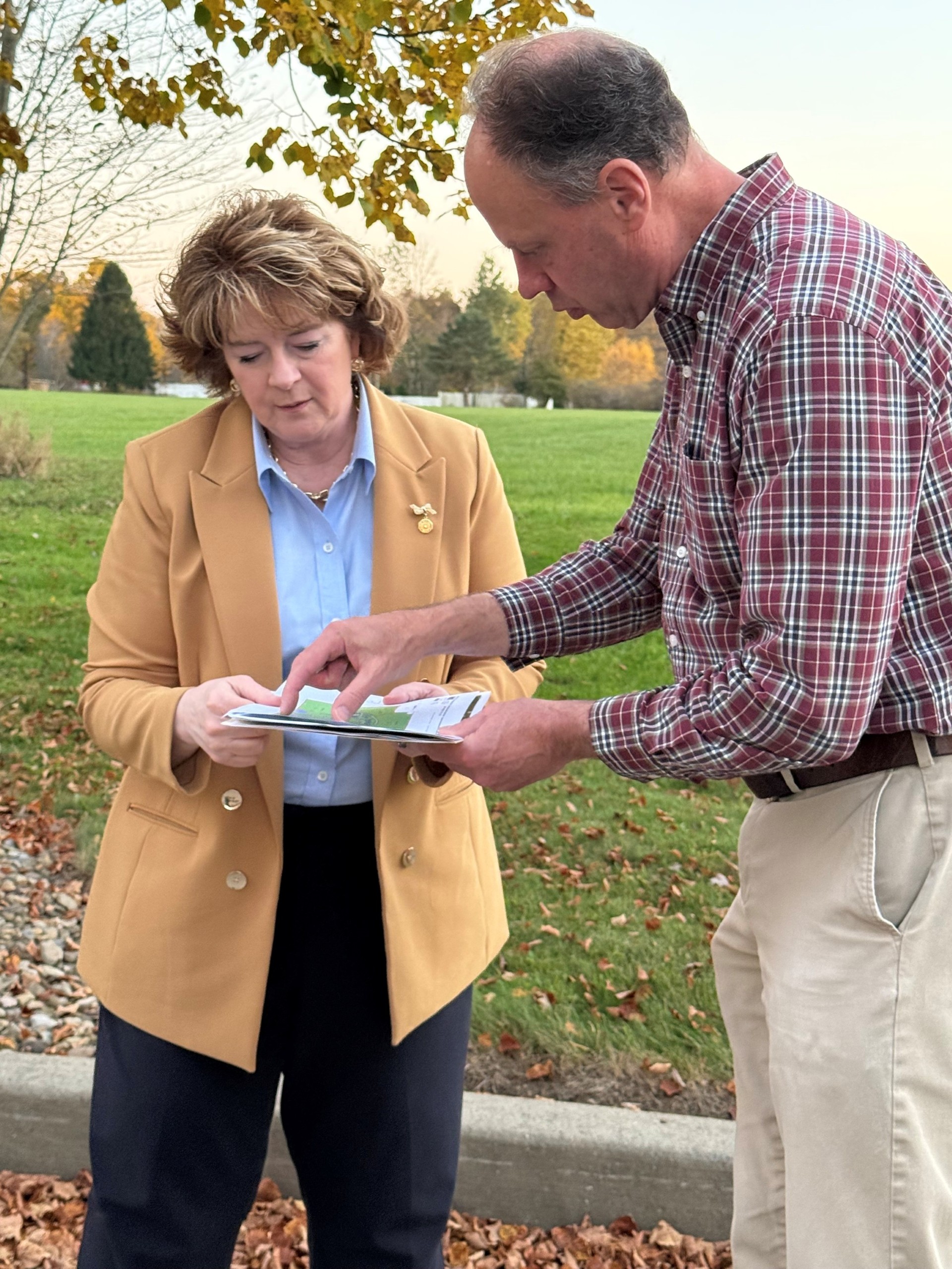 Senator Brooks speaking with a man